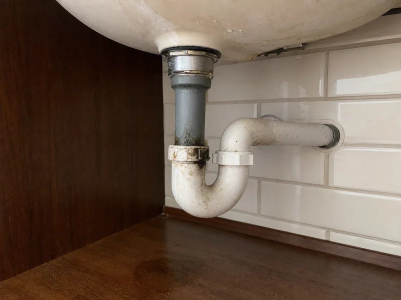Sink drain area before repair by Al-Jamal LLC